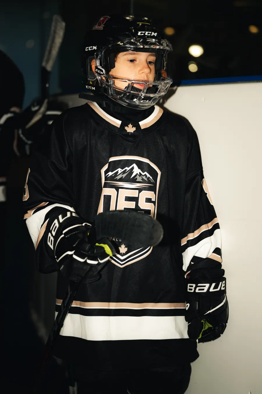 Young OFS player in the black team jersey