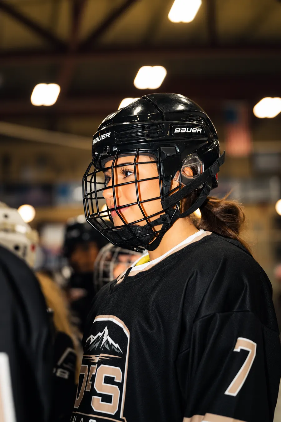 OFS player in her helmet and number 7 jersey at the rink